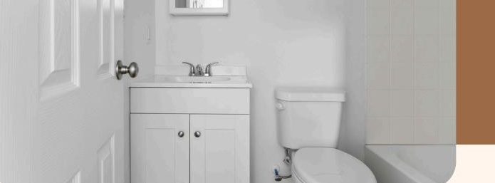 Private bathroom inside a HOME9 studio with vanity, toilet, and tub