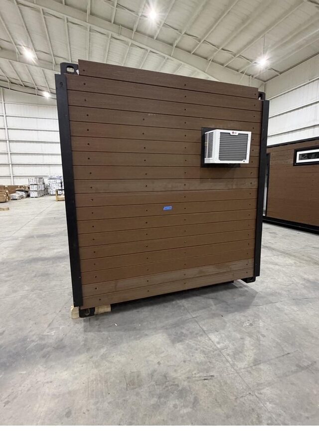 Window air-conditioning unit being installed